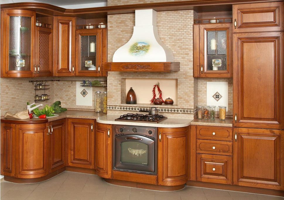 Eat-in kitchen - large 1960s galley ceramic tile eat-in kitchen idea in New York with dark wood cabinets, solid surface countertops, beige backsplash, ceramic backsplash, stainless steel appliances and an island