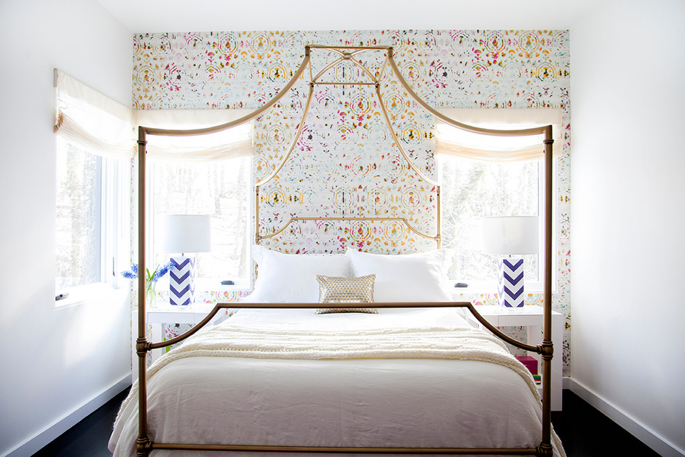 This is an example of a transitional bedroom in New York with multi-coloured walls.