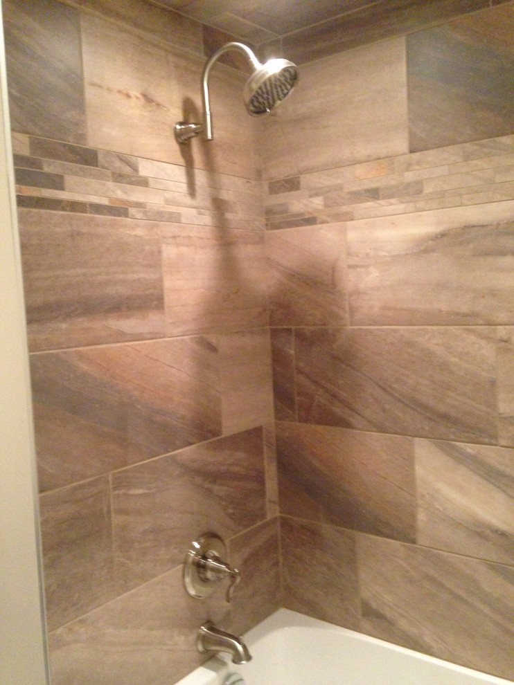 Example of a transitional home design design in Edmonton