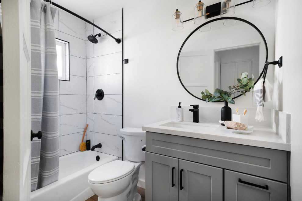 Bathroom - transitional 3/4 white tile brown floor and single-sink bathroom idea in Los Angeles with shaker cabinets, gray cabinets, white walls, an undermount sink, white countertops and a built-in vanity