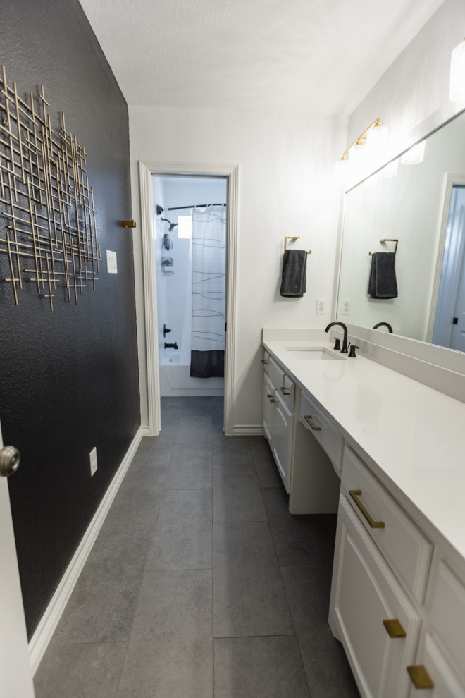 Example of a mid-sized transitional kids' white tile and porcelain tile porcelain tile, gray floor and single-sink bathroom design in Dallas with raised-panel cabinets, white cabinets, a one-piece toilet, black walls, an undermount sink, quartz countertops, white countertops and a built-in vanity
