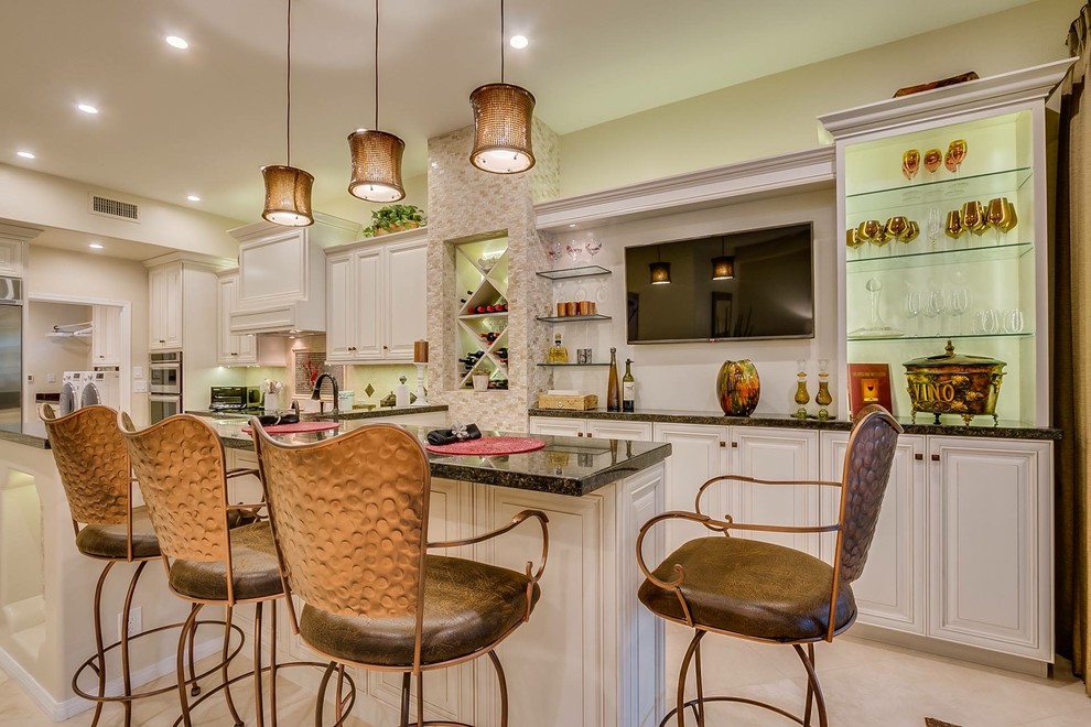 Inspiration for a kitchen remodel in Phoenix with beige cabinets, granite countertops and stainless steel appliances