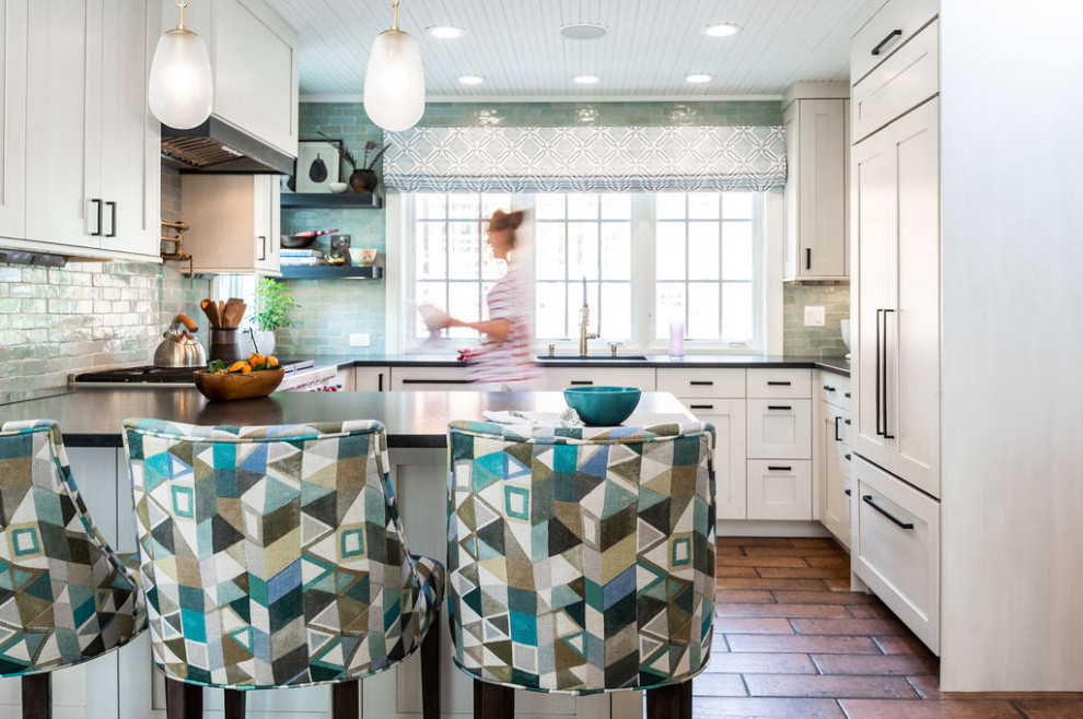Inspiration for a transitional terra-cotta tile and brown floor eat-in kitchen remodel in Baltimore with an undermount sink, white cabinets, granite countertops, terra-cotta backsplash, stainless steel appliances and black countertops