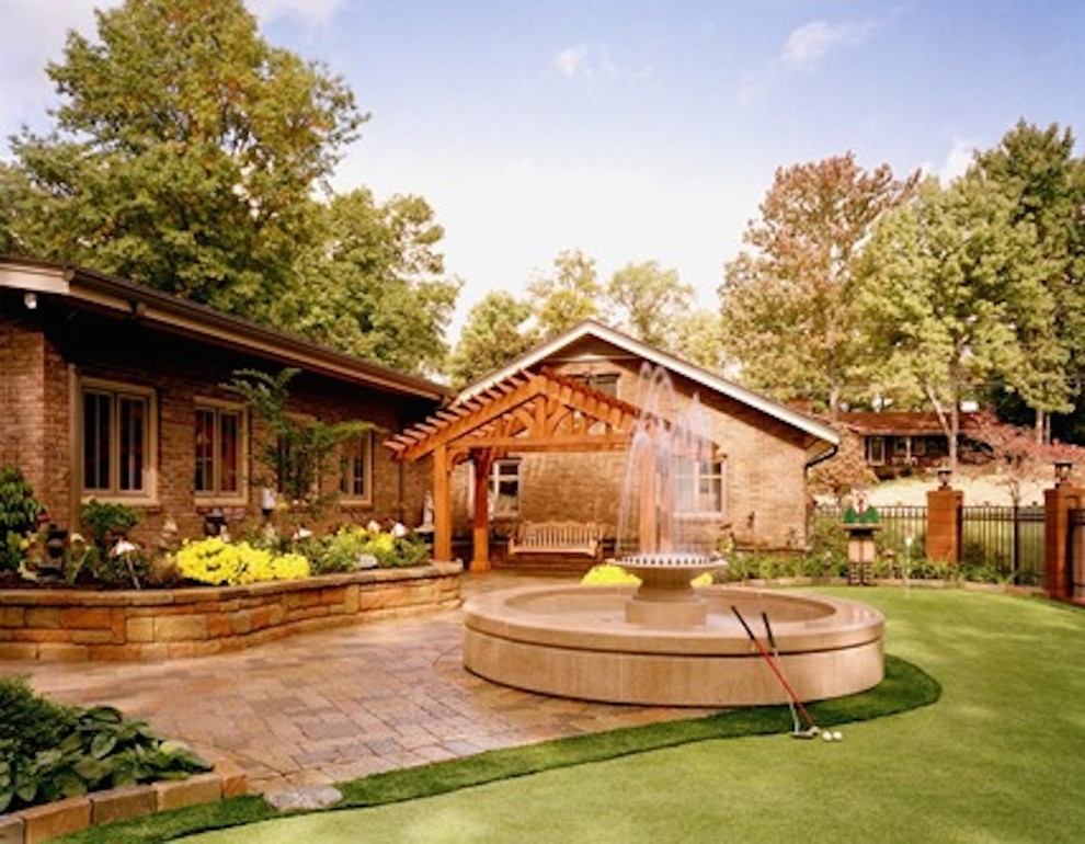 Photo of a mid-sized full sun backyard stone outdoor basketball/tennis/multi-game court for summer.