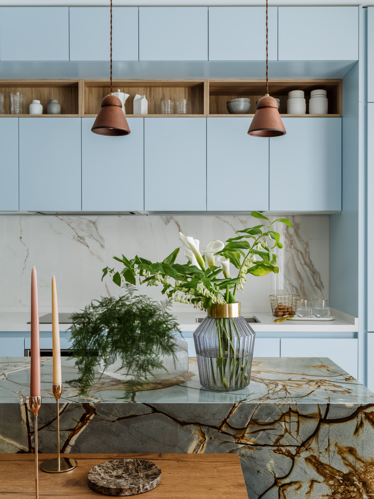 Inspiration for a medium sized contemporary single-wall open plan kitchen in Moscow with a single-bowl sink, flat-panel cabinets, blue cabinets, engineered stone countertops, white splashback, porcelain splashback, integrated appliances, porcelain flooring, an island, white floors and white worktops.