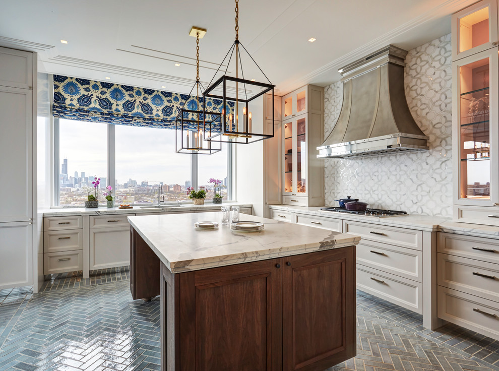 Design ideas for a transitional l-shaped kitchen in Chicago with an undermount sink, recessed-panel cabinets, beige cabinets, white splashback, panelled appliances, with island, grey floor and white benchtop.