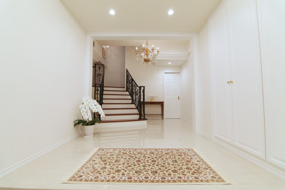Design ideas for a large contemporary entry hall with white walls, marble floors, a double front door, white floor, wallpaper and wallpaper.