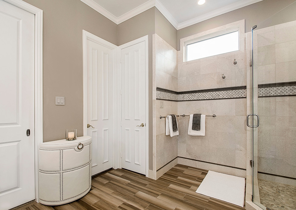 Large transitional 3/4 bathroom in Dallas with beaded inset cabinets, grey cabinets, a corner shower, beige tile, porcelain tile, grey walls, porcelain floors, an undermount sink, quartzite benchtops, brown floor and a hinged shower door.