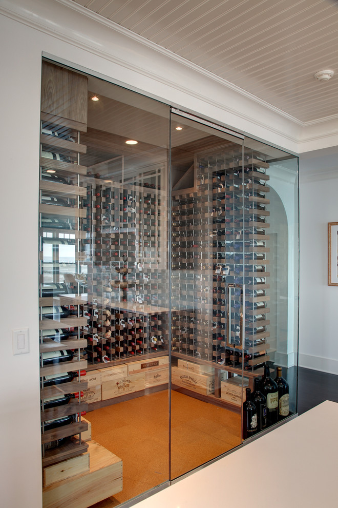 Inspiration for a beach style wine cellar in New York with cork floors.