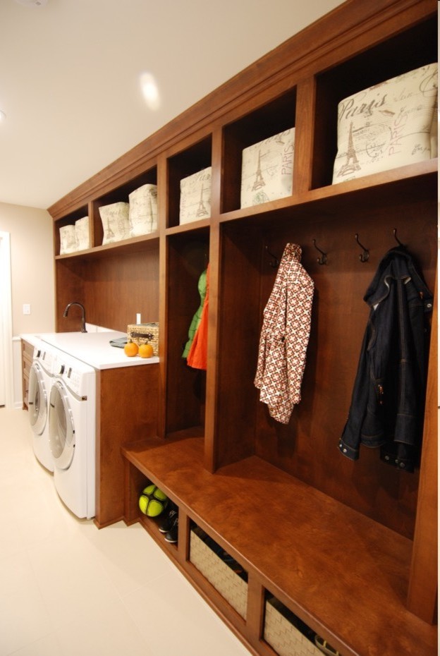 Inspiration for a modern laundry room in Minneapolis with solid surface benchtops.