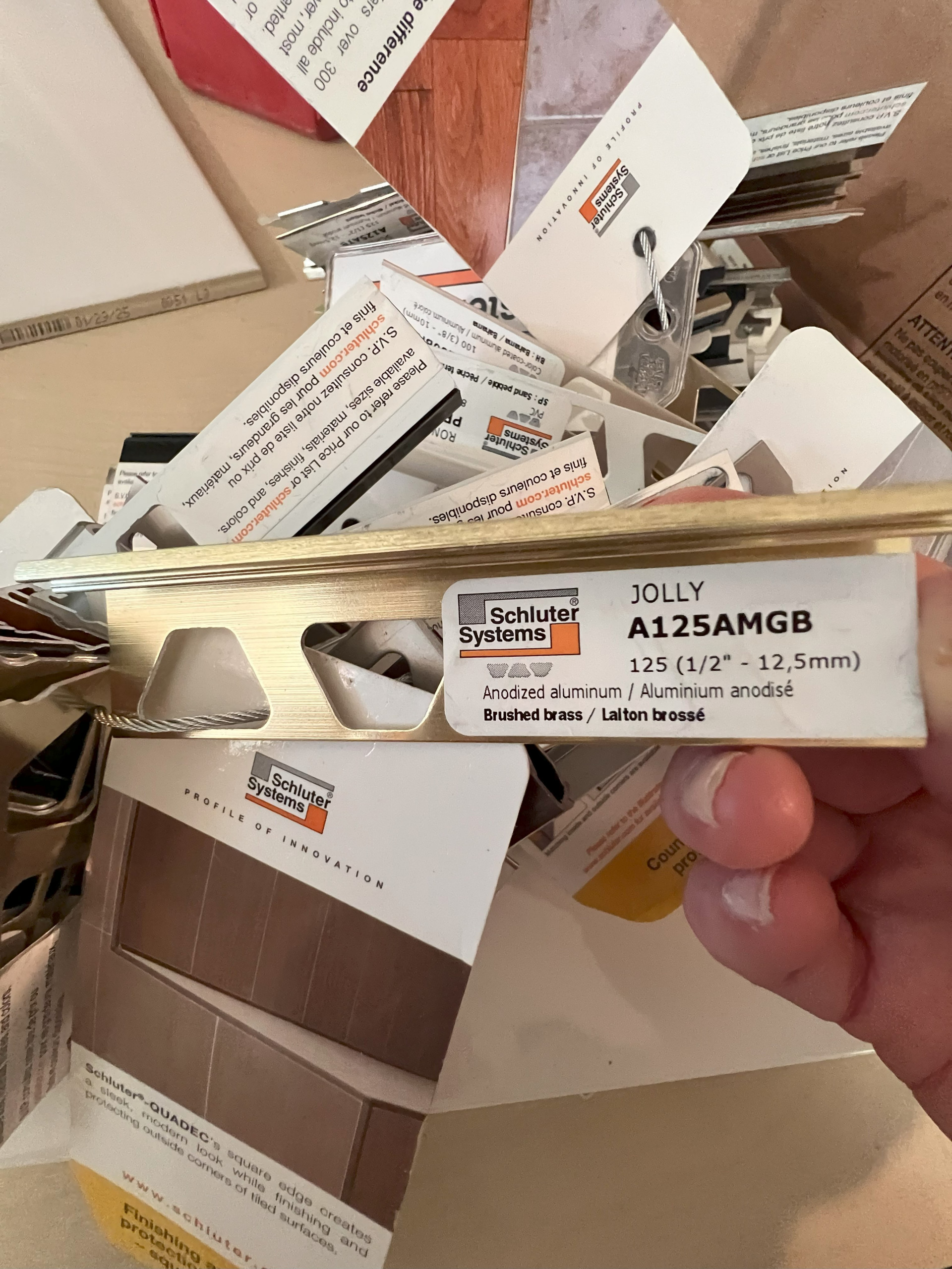 DURING! Selecting Tile Trim to Match Champagne Bronze Fixtures