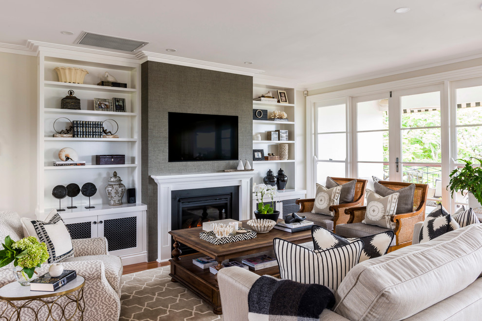 Mid-sized transitional formal open concept living room in Brisbane with a standard fireplace, a built-in media wall and medium hardwood floors.