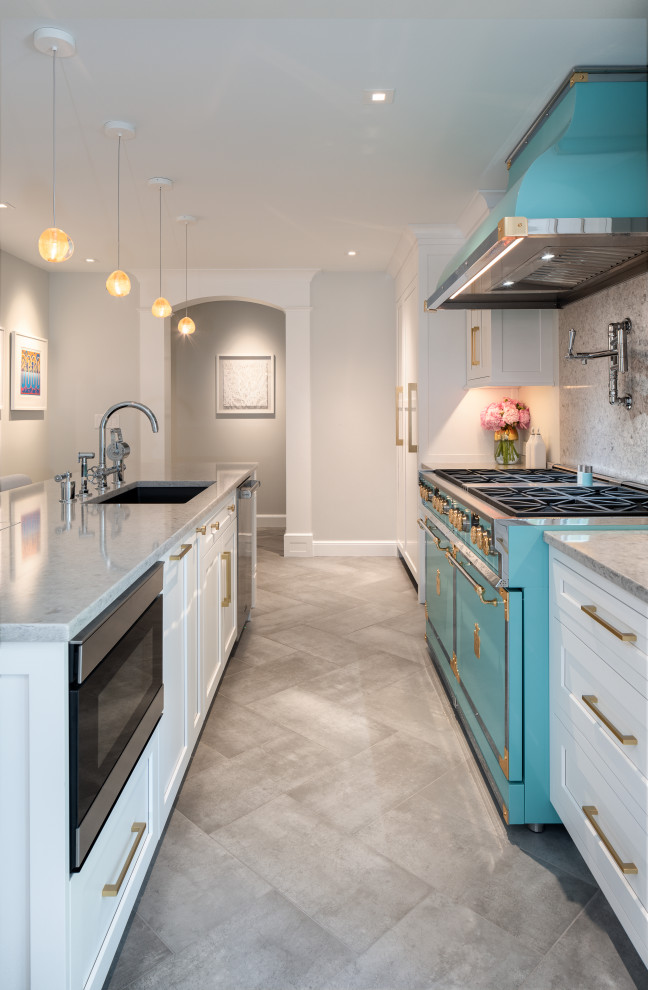Inspiration for a small contemporary galley separate kitchen in Philadelphia with an undermount sink, shaker cabinets, white cabinets, quartz benchtops, grey splashback, engineered quartz splashback, stainless steel appliances, porcelain floors, with island, grey floor and grey benchtop.