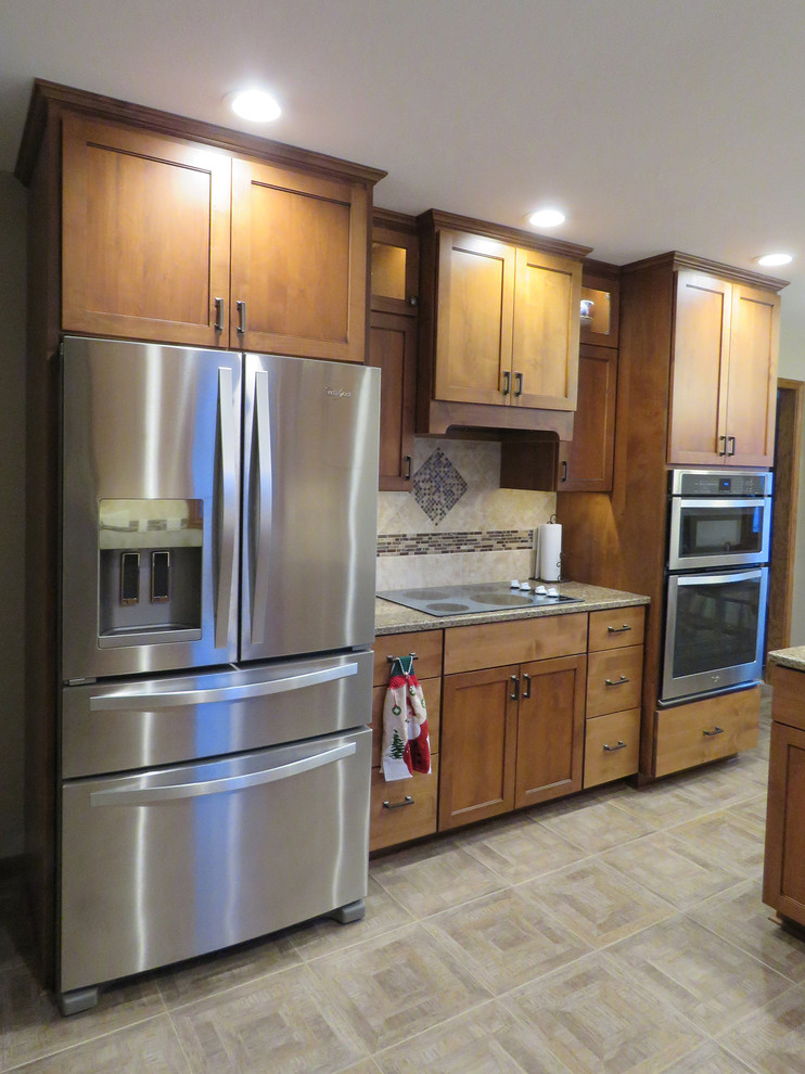 Inspiration for a mid-sized transitional u-shaped vinyl floor open concept kitchen remodel with a double-bowl sink, shaker cabinets, dark wood cabinets, quartz countertops, beige backsplash, cement tile backsplash, stainless steel appliances and a peninsula