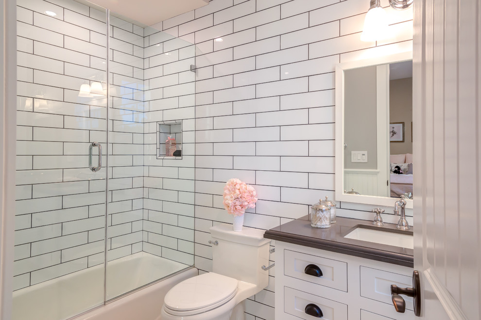 Photo of a small traditional 3/4 bathroom in Los Angeles with beaded inset cabinets, white cabinets, a one-piece toilet, white tile, glass tile, white walls, copper benchtops, brown benchtops, an alcove shower, a drop-in sink, a hinged shower door, mosaic tile floors, multi-coloured floor and a freestanding tub.