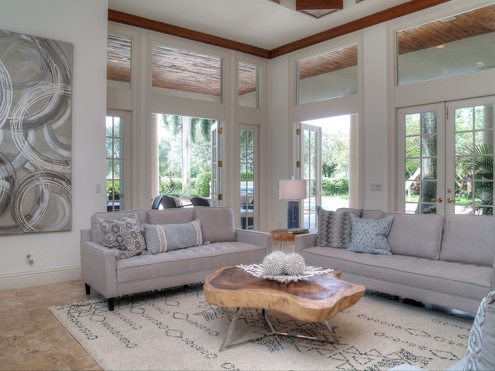 Inspiration for a transitional formal open concept living room in Miami with ceramic floors, no fireplace, beige floor and white walls.