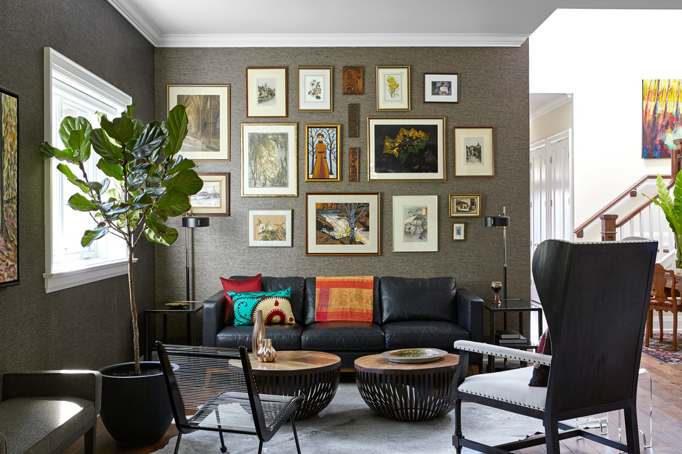 Eclectic open concept living room in Toronto with grey walls and dark hardwood floors.