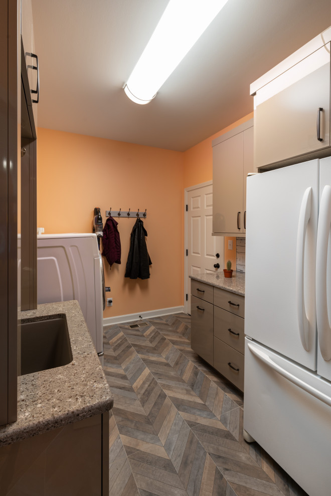 Medium sized galley utility room in Kansas City with a submerged sink, flat-panel cabinets, beige cabinets, engineered stone countertops, yellow walls, porcelain flooring, a side by side washer and dryer, multi-coloured floors and multicoloured worktops.