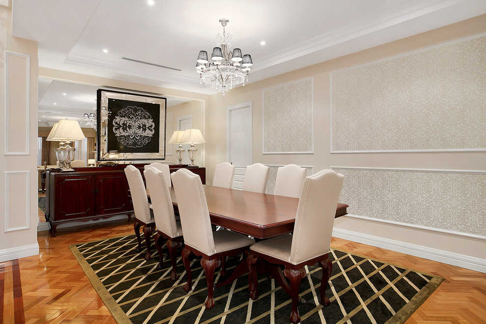 Traditional dining room in Melbourne with beige walls and medium hardwood floors.