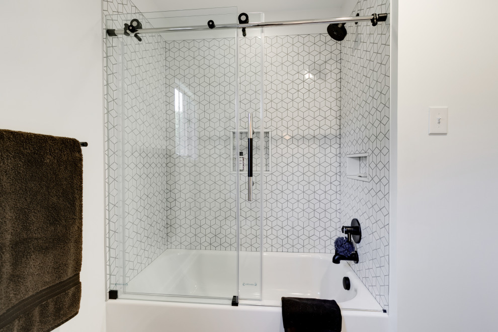 Inspiration for a medium sized modern bathroom in Richmond with flat-panel cabinets, white cabinets, a shower/bath combination, white tiles, ceramic tiles, white walls, ceramic flooring, grey floors, a sliding door, white worktops, a single sink and a floating vanity unit.