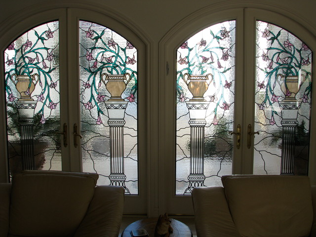Arched French Doors With Stained And Leaded Glass Inserts
