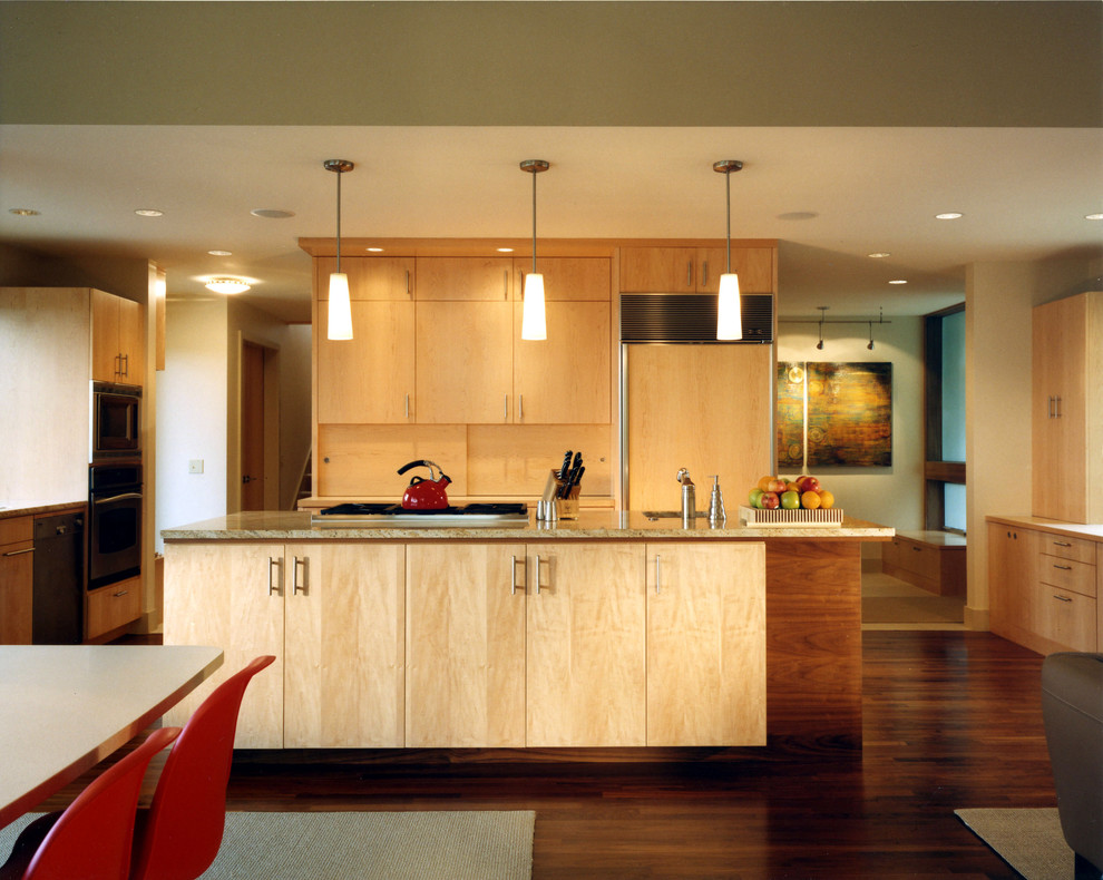 Inspiration for a contemporary kitchen in Seattle with flat-panel cabinets and light wood cabinets.