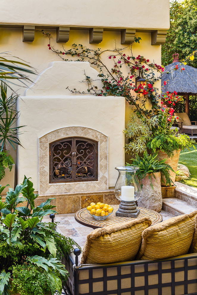 Design ideas for a mediterranean patio in Santa Barbara with a fire feature.
