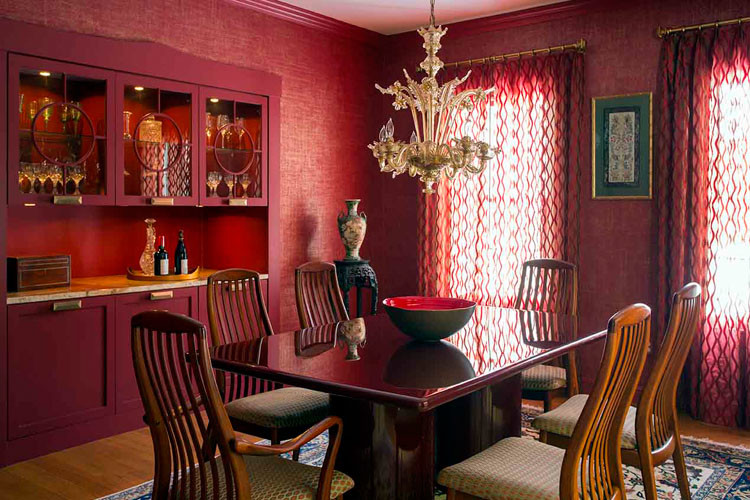 Photo of a contemporary dining room in Boston with red walls and medium hardwood floors.