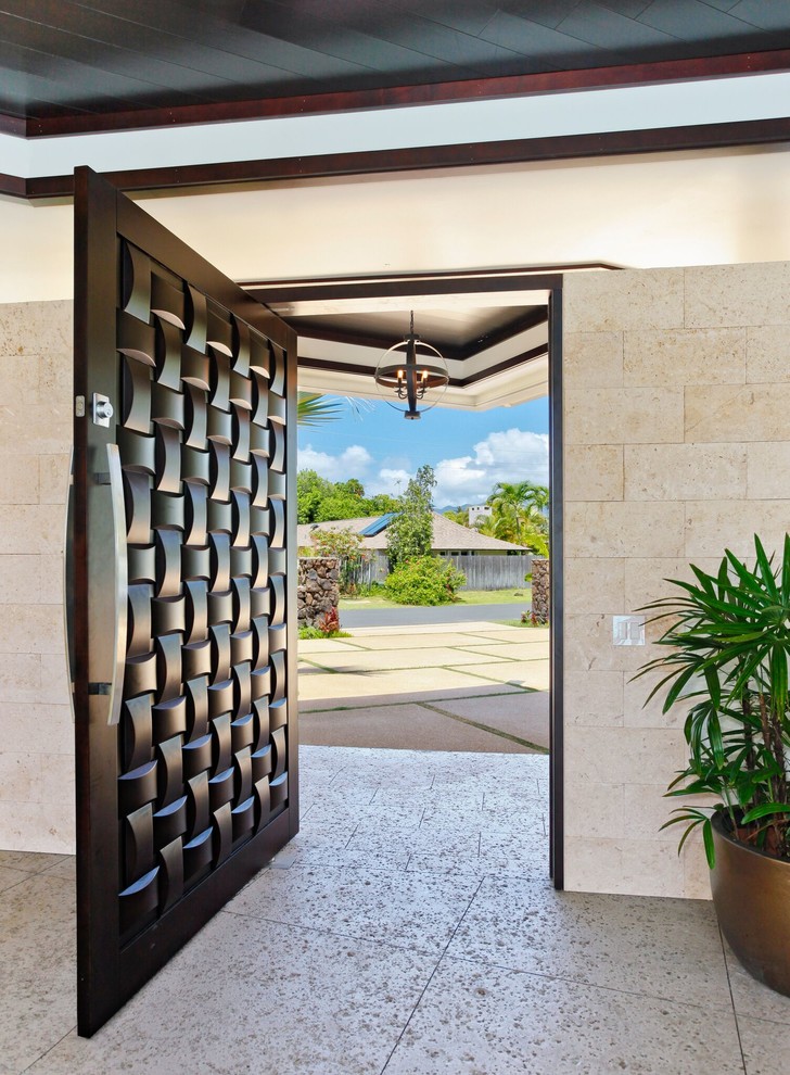 Large modern front door in Hawaii with a single front door and a brown front door.