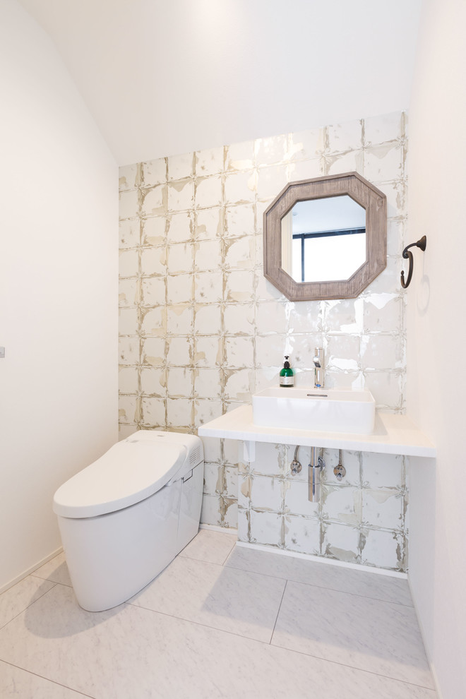 Photo of a mid-sized modern powder room in Yokohama with open cabinets, white cabinets, a one-piece toilet, white walls, plywood floors, a vessel sink, solid surface benchtops, white floor, white benchtops, white tile, porcelain tile, a floating vanity, wallpaper and wallpaper.