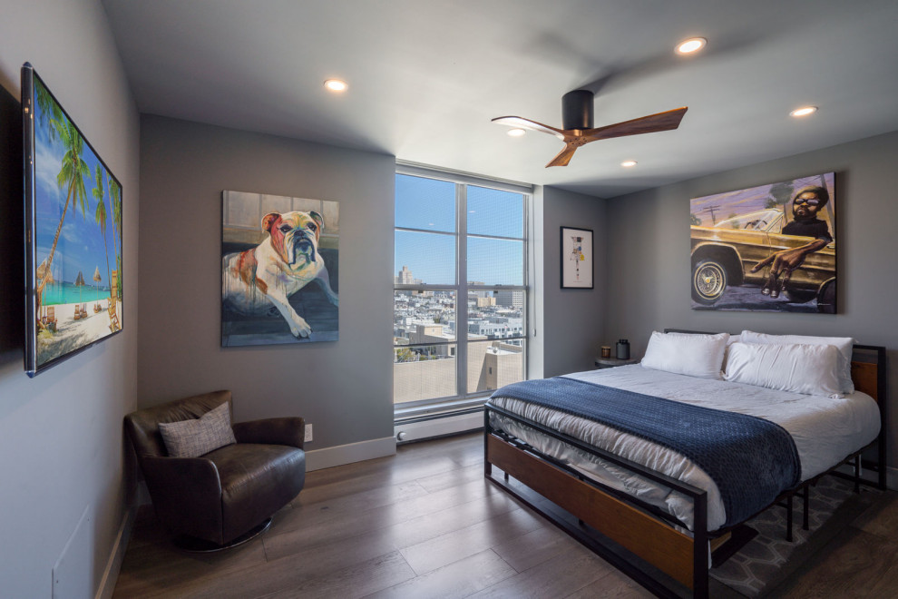 Mid-sized 1950s master vinyl floor, brown floor and vaulted ceiling bedroom photo in Los Angeles with gray walls and no fireplace