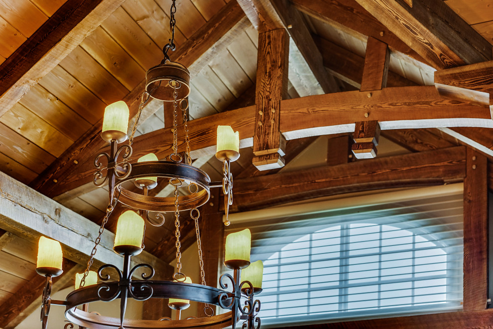 Example of a mountain style home design design in Calgary