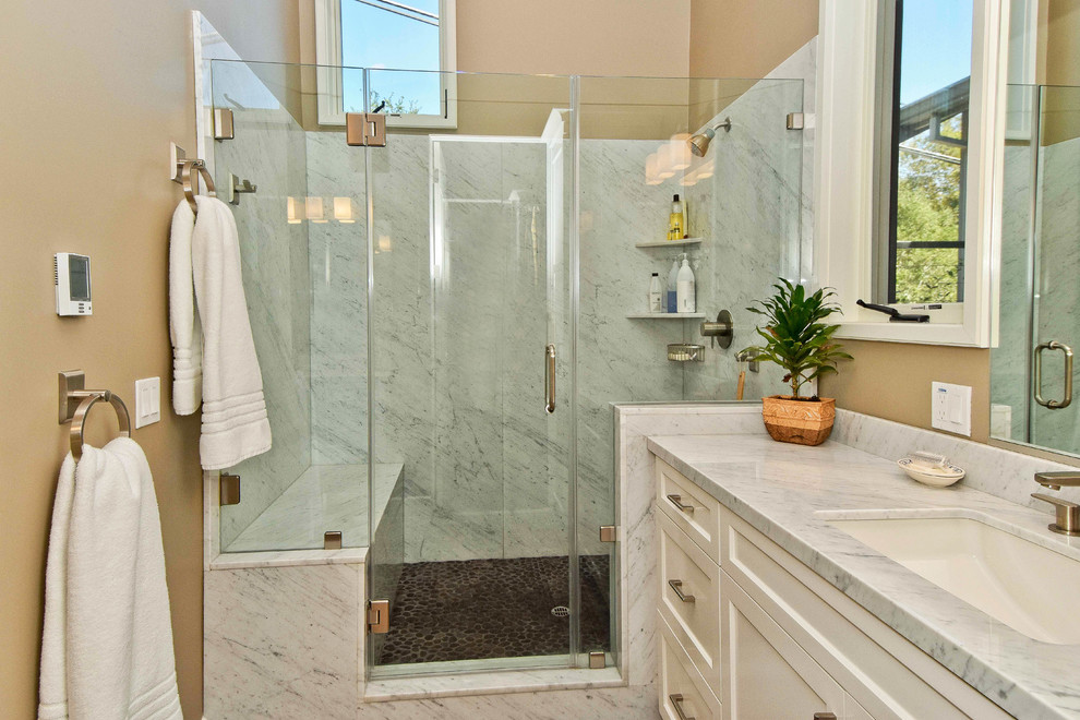 This is an example of a transitional bathroom in San Francisco with an undermount sink, recessed-panel cabinets, white cabinets and an alcove shower.