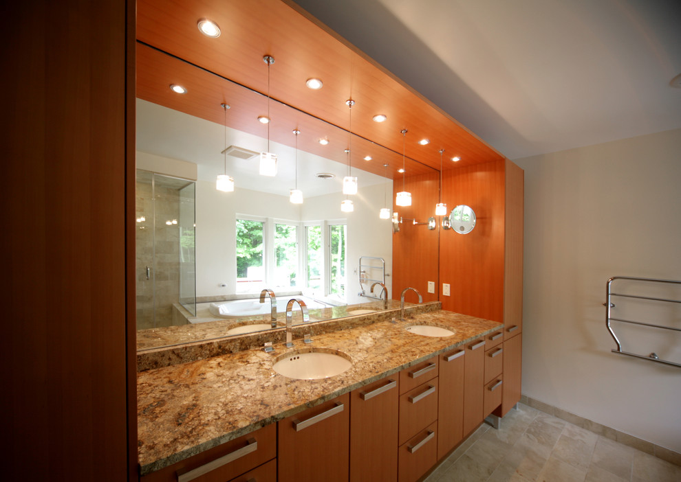 Inspiration for a large contemporary bathroom in Burlington with flat-panel cabinets, medium wood cabinets, a freestanding tub, a two-piece toilet, beige tile, stone tile, white walls, travertine floors, an undermount sink, granite benchtops and with a sauna.