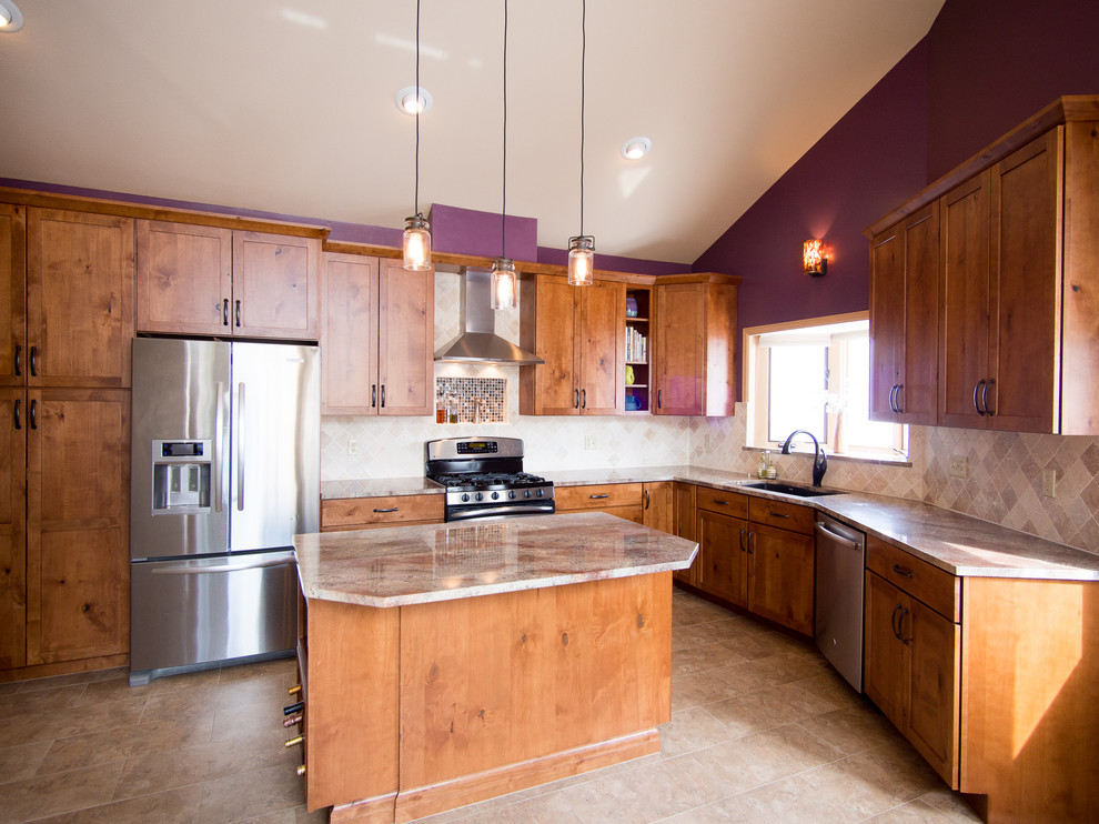 Large arts and crafts l-shaped ceramic tile and beige floor open concept kitchen photo in Denver with an undermount sink, shaker cabinets, medium tone wood cabinets, granite countertops, beige backsplash, ceramic backsplash, stainless steel appliances and an island