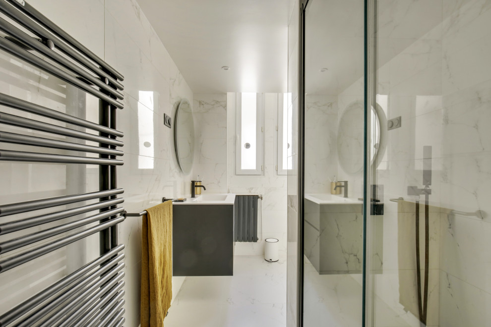 Small contemporary master bathroom in Paris with beaded inset cabinets, black cabinets, a curbless shower, a wall-mount toilet, white tile, ceramic tile, white walls, ceramic floors, an undermount sink, engineered quartz benchtops, white floor, a sliding shower screen, white benchtops, a laundry, a single vanity and a floating vanity.