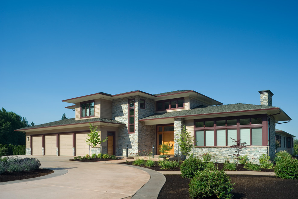 This is an example of a contemporary two-storey exterior in Portland with a hip roof.