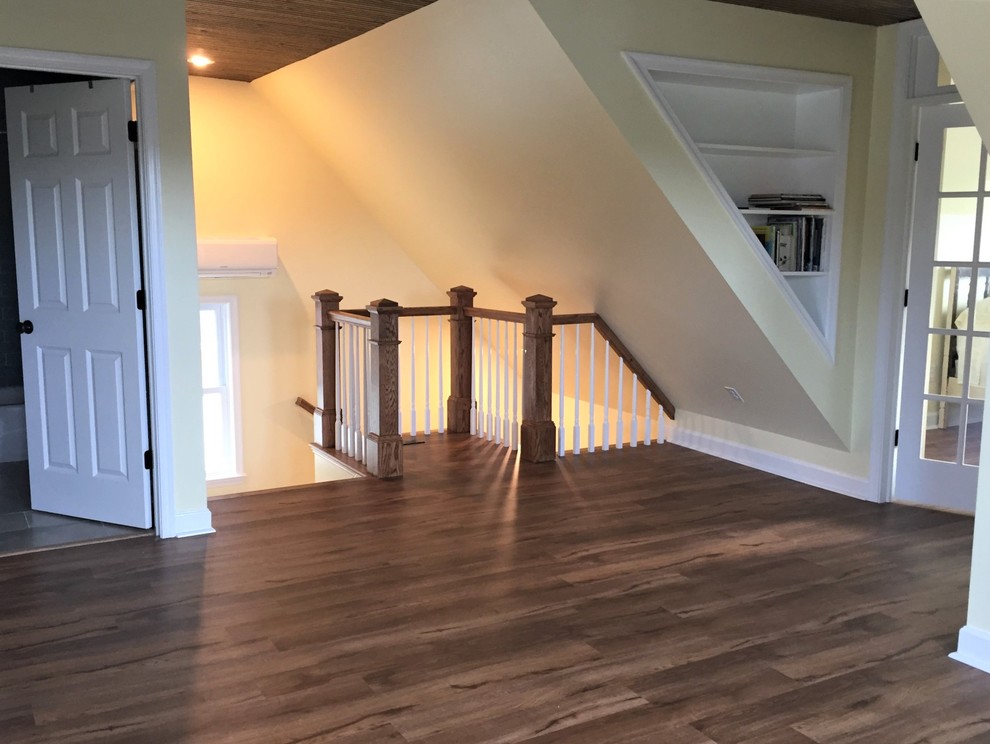 Example of a large classic loft-style vinyl floor home design design with yellow walls