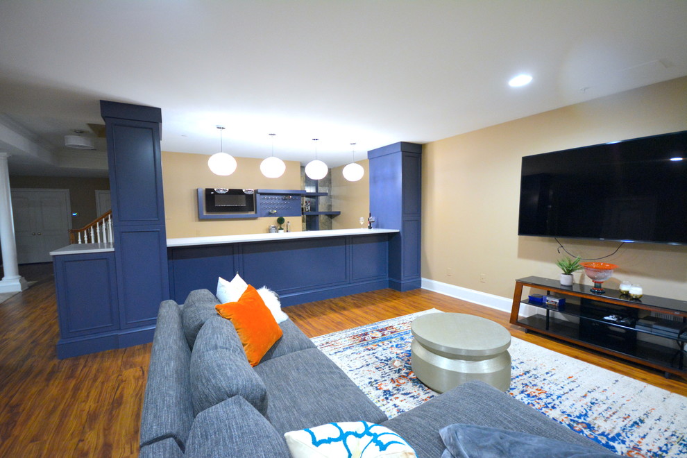 This is an example of a mid-sized contemporary galley wet bar in Philadelphia with shaker cabinets and blue cabinets.