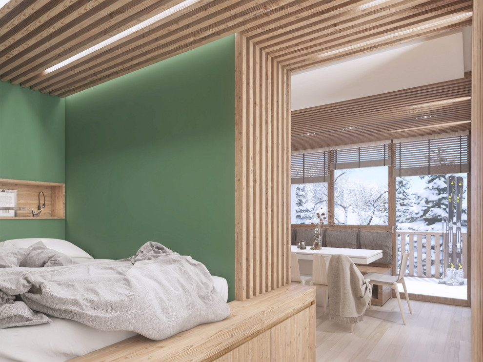 Ejemplo de dormitorio principal rural con suelo de madera clara