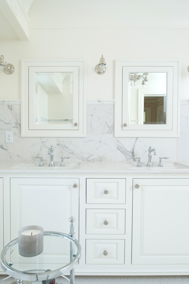 Photo of a mid-sized traditional master bathroom in Kansas City with furniture-like cabinets, white cabinets, marble benchtops, a freestanding tub, an alcove shower, white tile, porcelain tile, white walls and porcelain floors.