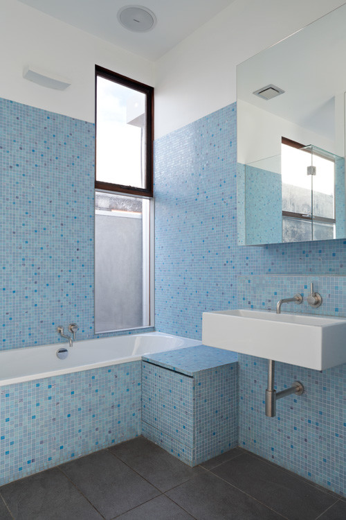 Photo of a mid-sized contemporary master bathroom in Melbourne with a wall-mount sink, a drop-in tub, a shower/bathtub combo, blue tile, mosaic tile, blue walls and ceramic floors.