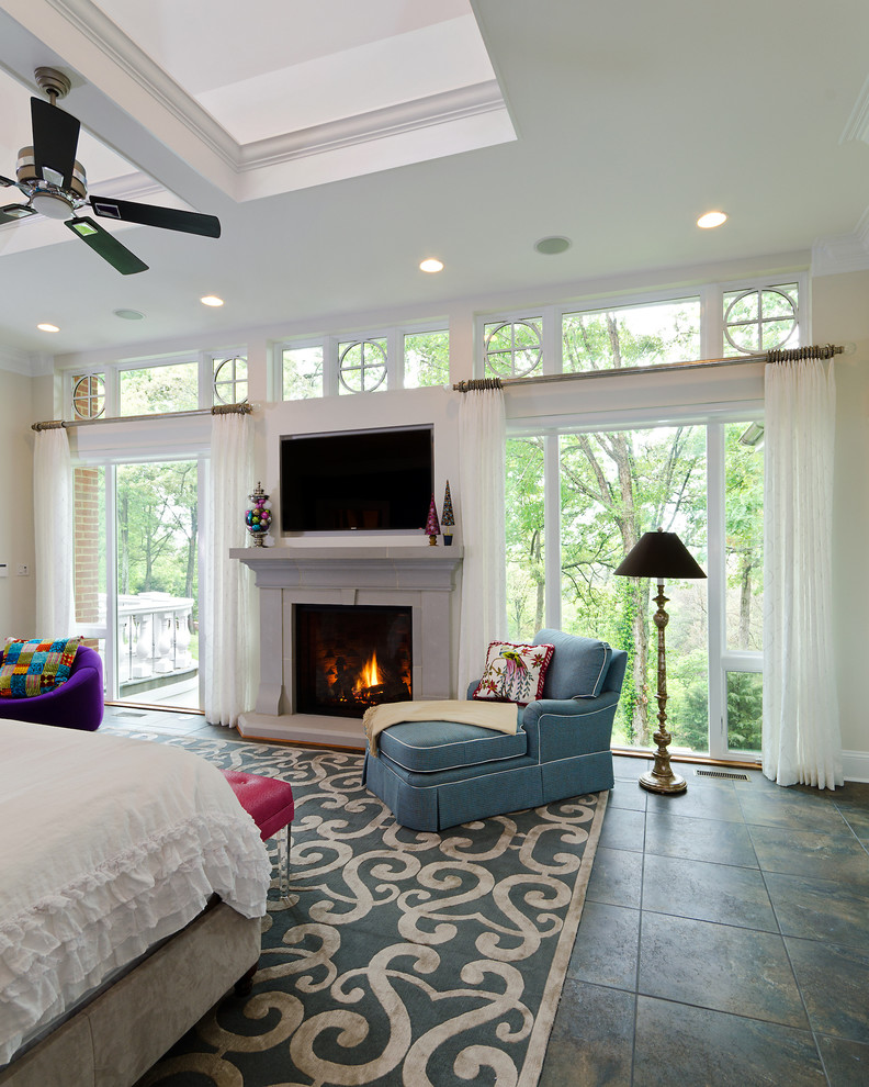 Photo of a large transitional master bedroom in Richmond with white walls, slate floors, a standard fireplace and a stone fireplace surround.