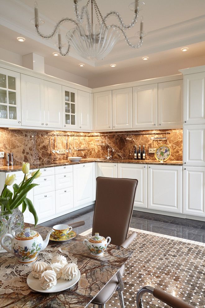 Photo of a transitional l-shaped kitchen in Moscow with white cabinets and brown splashback.