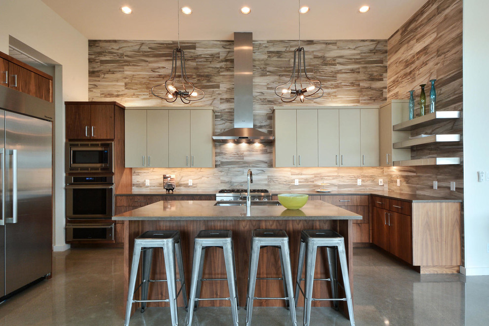 Design ideas for a large contemporary u-shaped kitchen in Austin with an undermount sink, flat-panel cabinets, beige cabinets, multi-coloured splashback, stainless steel appliances, concrete floors and with island.