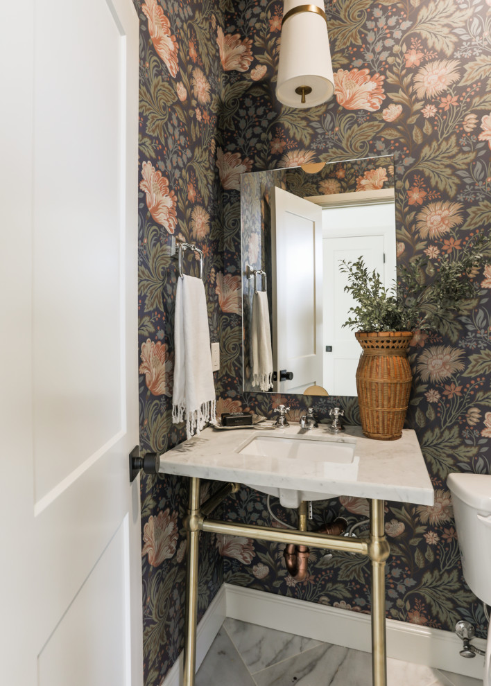 Design ideas for a transitional powder room in Oklahoma City with marble benchtops and wallpaper.