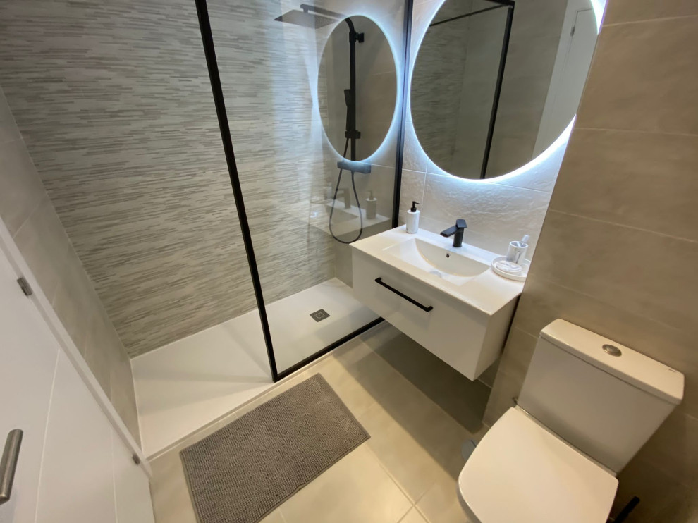 This is an example of a medium sized contemporary cloakroom in Madrid with freestanding cabinets, white cabinets, a two-piece toilet, grey tiles, ceramic tiles, multi-coloured walls, porcelain flooring, an integrated sink, engineered stone worktops, grey floors, white worktops and a floating vanity unit.