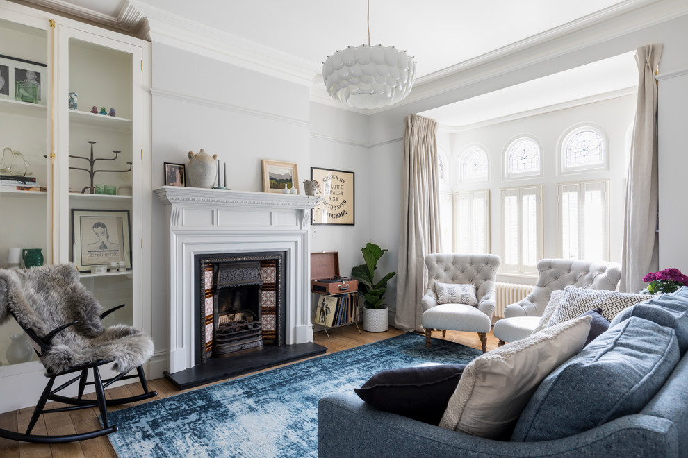Design ideas for a transitional open concept living room in London.