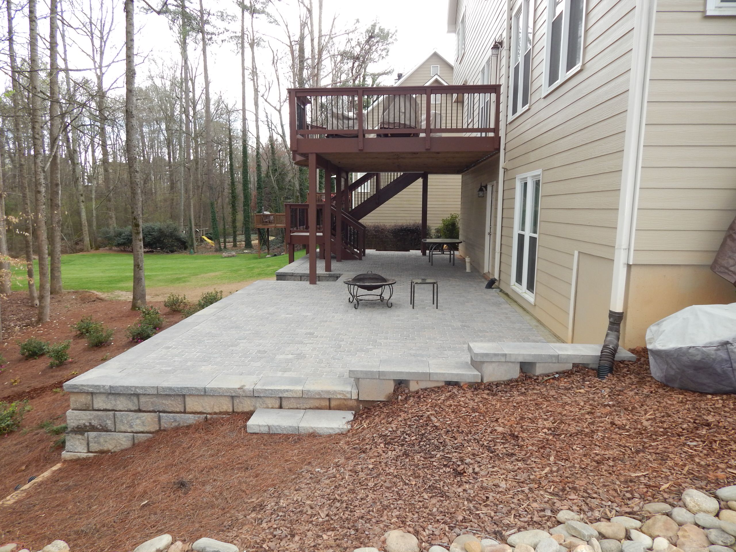 Block wall and tumbled paver patio
