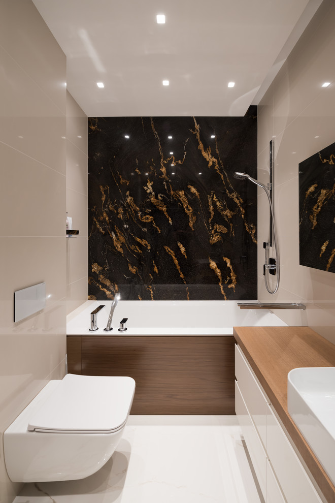 Inspiration for a small master bathroom in Moscow with flat-panel cabinets, white cabinets, an alcove tub, a shower/bathtub combo, a wall-mount toilet, beige tile, porcelain tile, marble floors, a vessel sink, wood benchtops, white floor and an open shower.